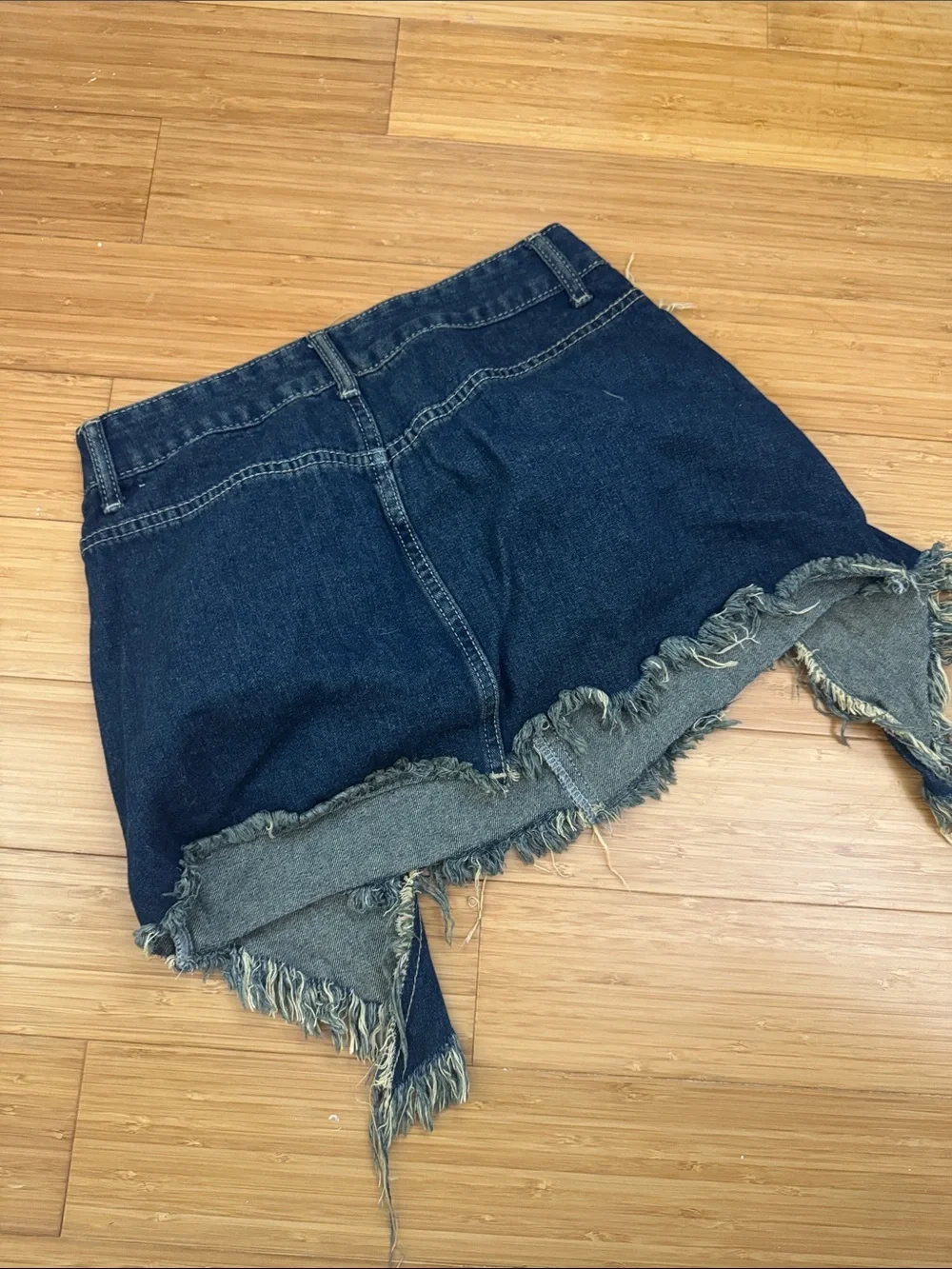 Dark Blue Distressed Denim Mini Skirt with Frayed Hem - Picture 2 of 2